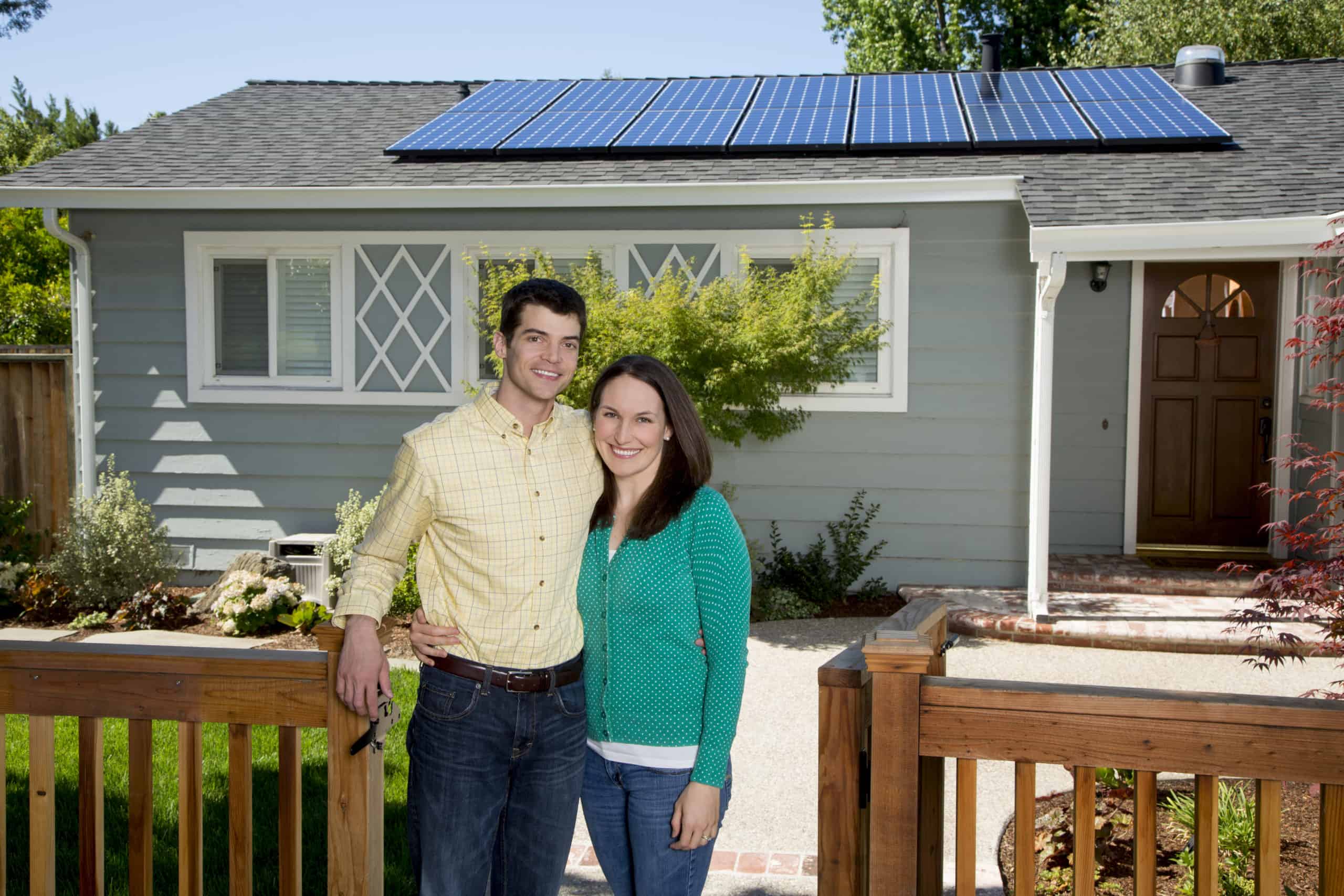 Happy Couple With SunPower Solar Panels