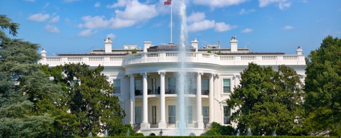 Washington DC skyline at night with city lights, representing urban energy demand, rising utility costs, and transition to solar energy solutions, District Energy