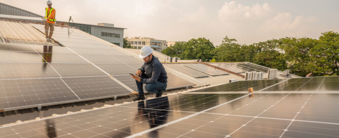 solar technicians inspecting commercial rooftop solar panels in DC and Maryland to maximize SREC earnings before 2026 market changes